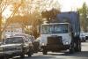 Truck picking up residential waste. 